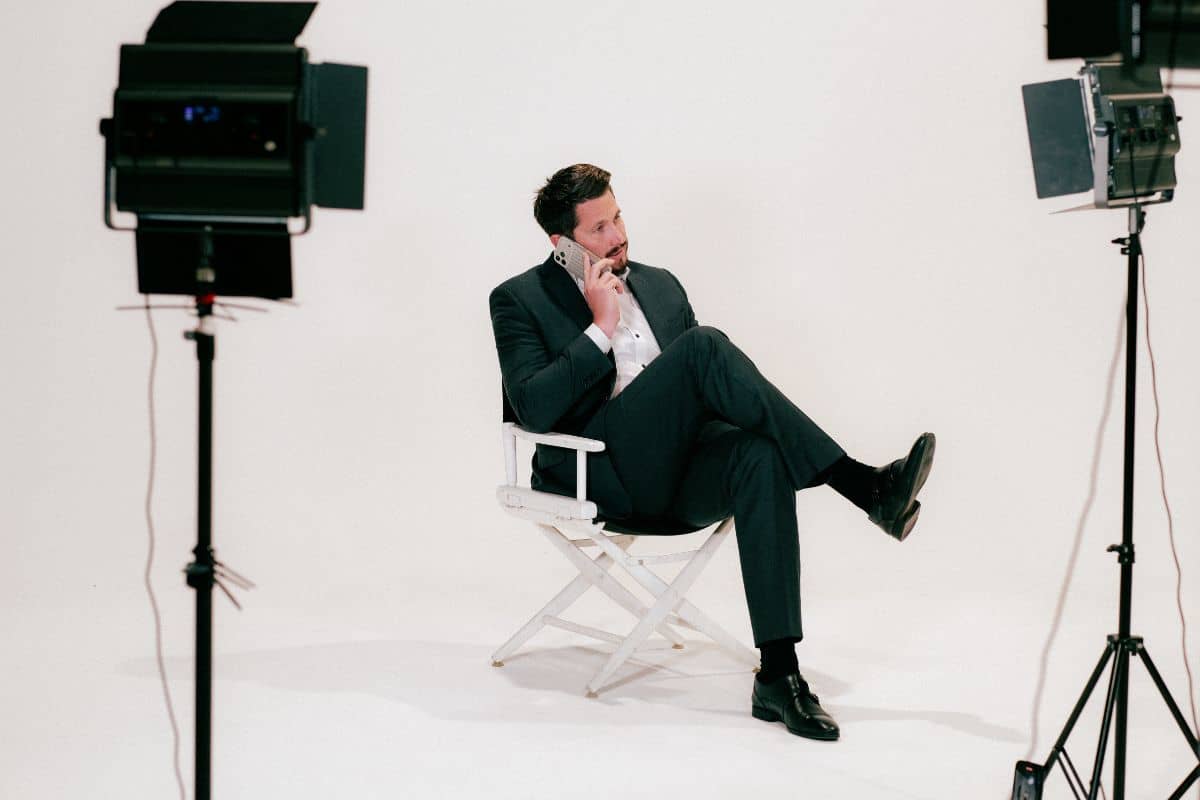 A Suresecure employee is sitting in the director’s chair and talking on the phone; IT security consultancy